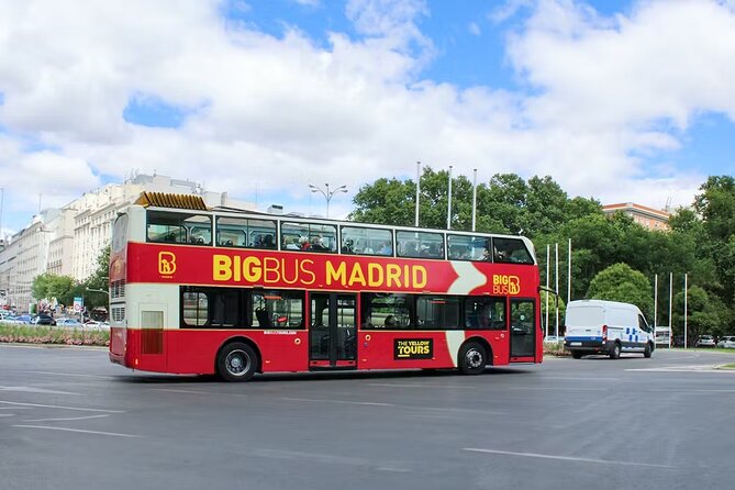 Big Bus Madrid Panoramic City Tour - Cibeles Fountain, Royal Palace exteriors, and Temple of Debod at dusk