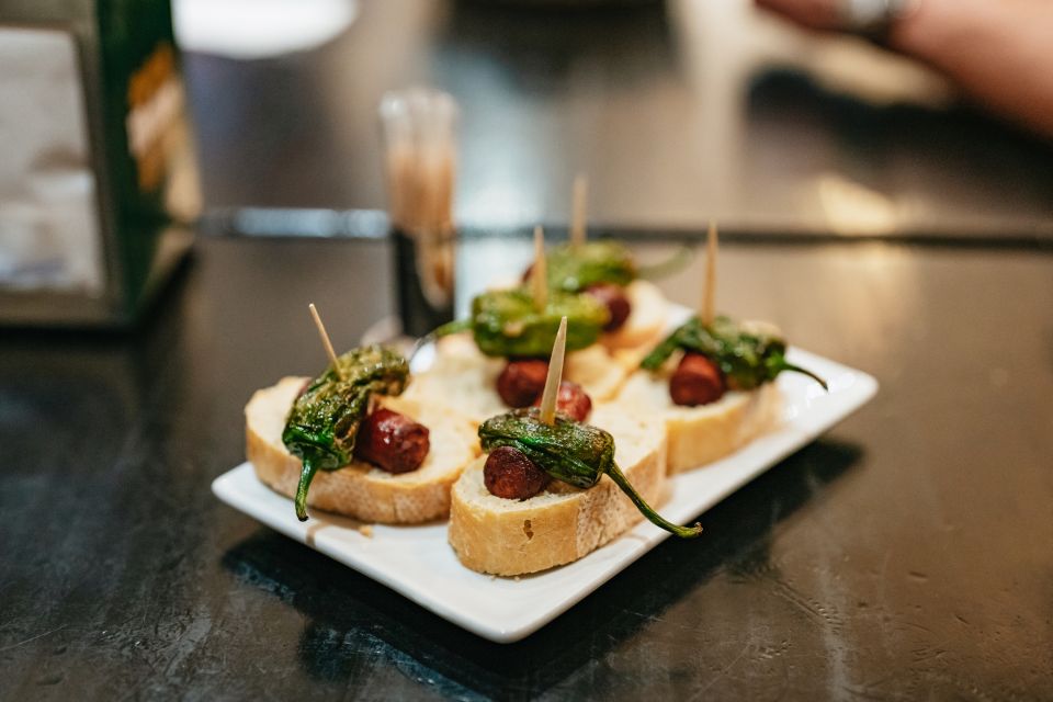 Madrid: Guided Tapas Tour with Tastings and Drinks - Stop 1: Warm-up flavors at a market cuisine restaurant