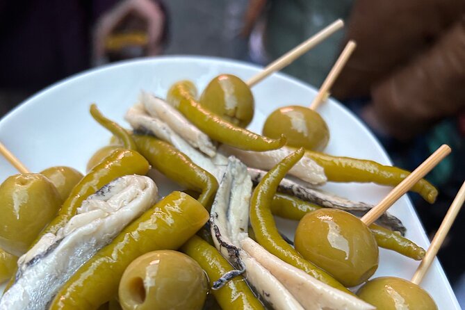 Madrid Local Tapas Tour with Private Dinner and Bottomless Wine - Where the Night Starts: Calle de Atocha and a Cava Welcome
