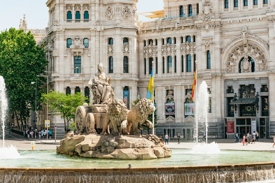 Madrid: Panoramic Route City Tour - Add-ons worth your time: the tips-based walking tour and La Quimera flamenco drink