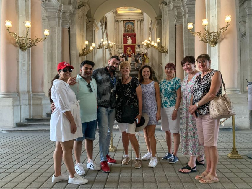 Madrid: Royal Palace Entry Ticket and Small Group Tour - Plaza de la Armería and tapestries: where the palace looks its most dramatic