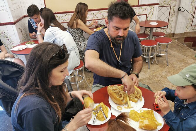 Madrid: Street Food Walking Tour in the Plaza Mayor Area - Calle Mayor story stops and the calamari sandwich moment