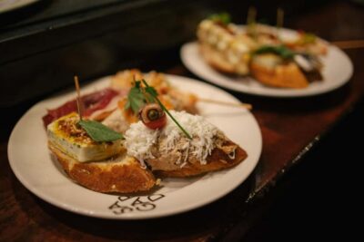 Madrid: Tapas Dinner Party Food Tour with Guide - The Tapas Menu: Tortilla, Stuffed Mushrooms, and Cheese You Can Actually Find Again