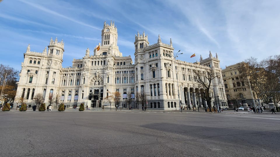 Tour Madrid: Secrets in a Electric Tuk Tuk - Meeting at Frente a la Bolsa y el Hotel Ritz, then back again